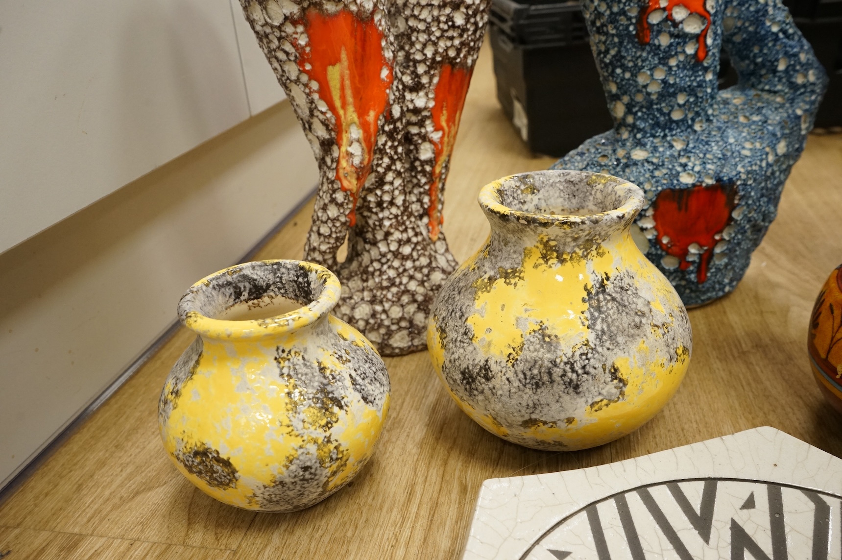 A collection of studio ceramics and pottery to include a Zsolnay vase and a Lyn Alves hexagonal dish